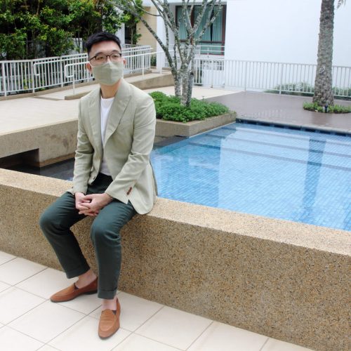 Light Brown Bespoke Suit Model Sitting Down